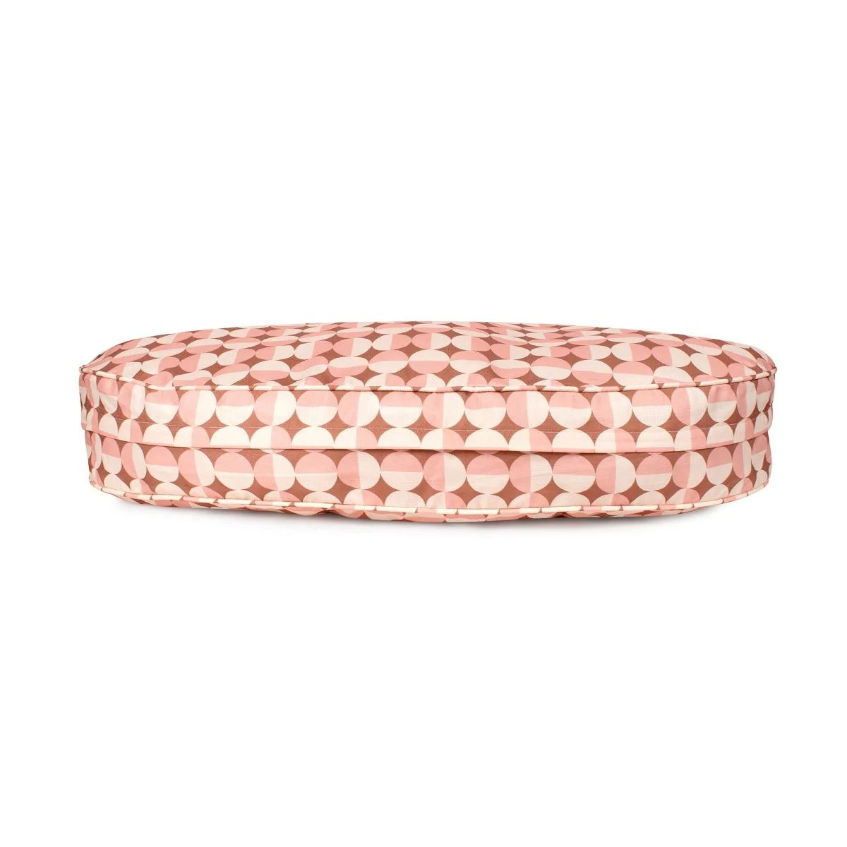 Round pink cushion with geometric pattern on a white background