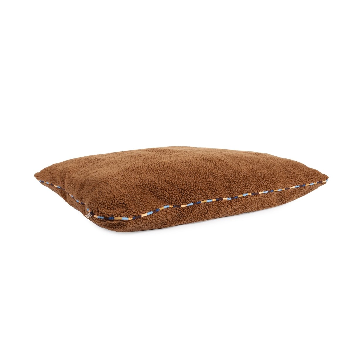 Brand Stripe Sherpa Pillow | Rust, angled view