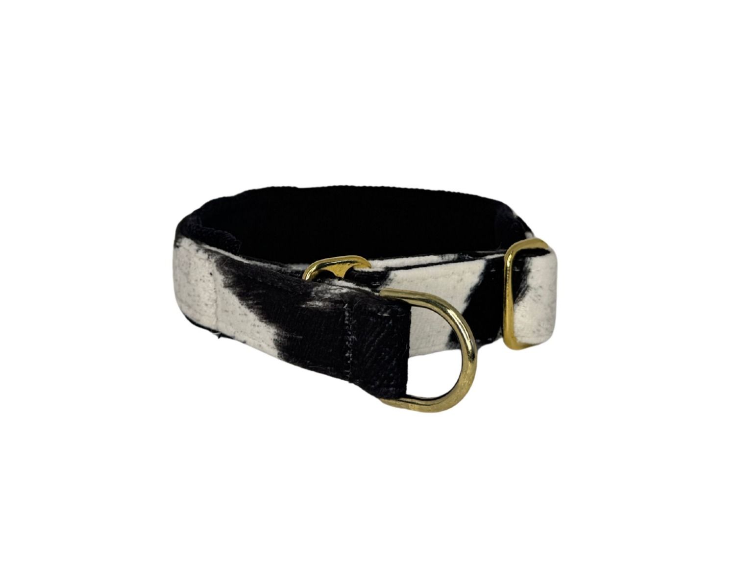 Black and white cowhide belt with brass buckle on a white background